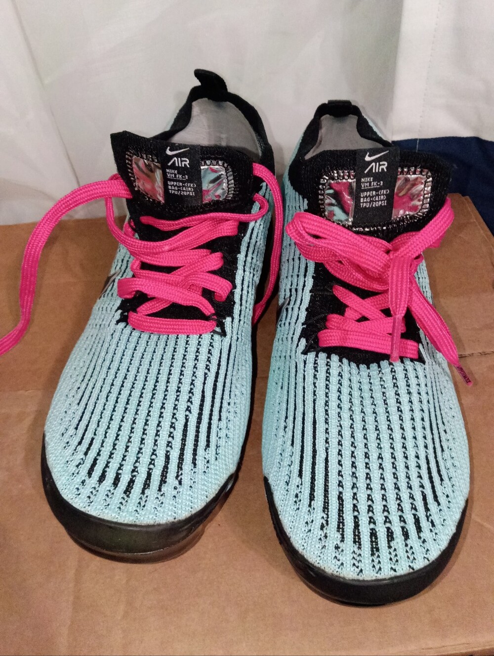 Nike Women’s Blue Flyknit Sneakers with Hot Pink Laces